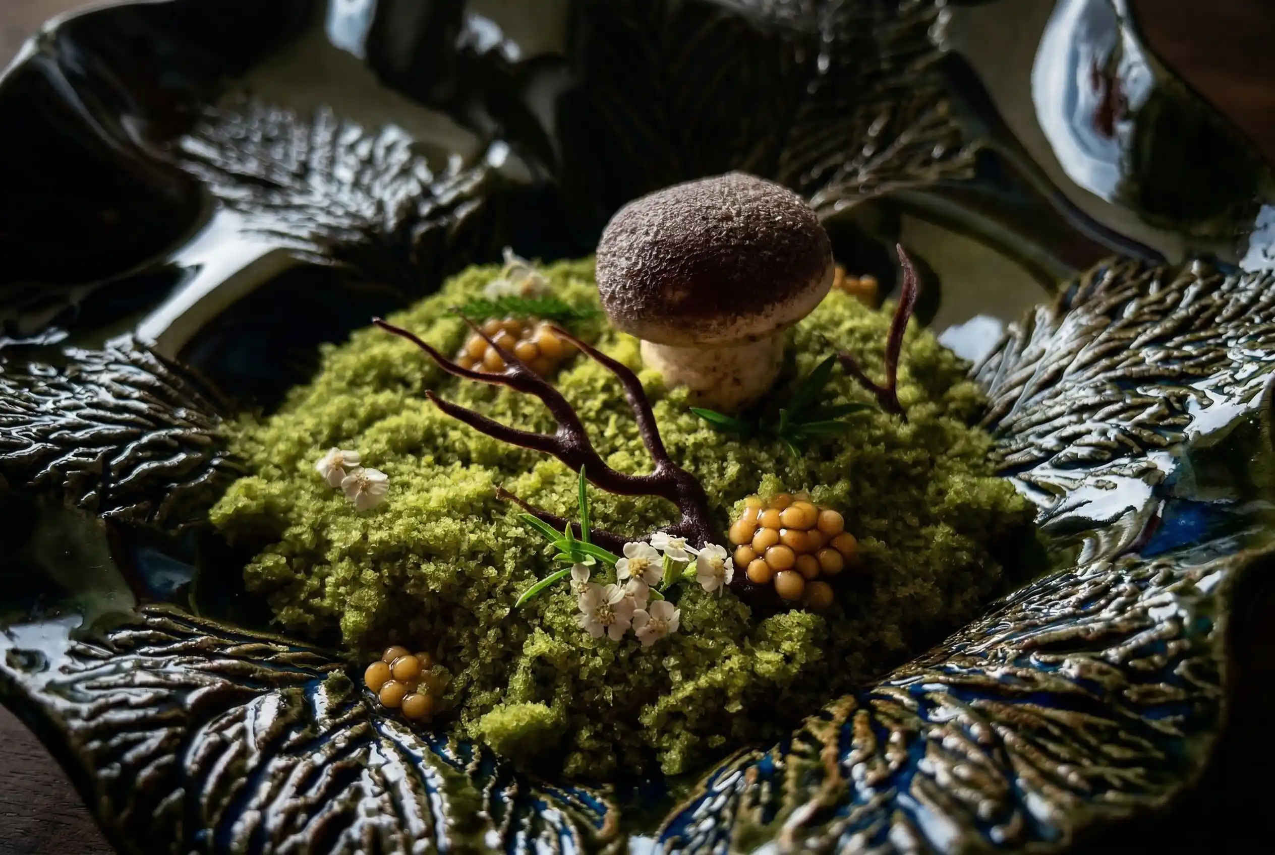 Hand-thrown ceramic plate with herbs, moss and flowers — Gostilna Mahorčič tasting menu
